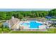 Community pool and amenity center with a slide and tennis courts surrounded by lush greenery at 1016 Spanish Moss Rd, Indian Trail, NC 28079