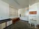 Basement with pegboard walls, workbench, and sink at 1043 Cambrook Ct, Concord, NC 28027