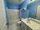 A full blue bathroom with a shower and bathtub combination, vanity with sink and large mirror at 1043 Cambrook Ct, Concord, NC 28027