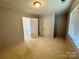 A bedroom featuring neutral carpeting and double closets at 1043 Cambrook Ct, Concord, NC 28027
