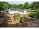 Backyard with raised garden beds and lush landscaping at 10743 Ola Dr, Fort Mill, SC 29707