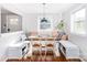 Bright dining area with built-in bench seating and wooden dining table at 10743 Ola Dr, Fort Mill, SC 29707
