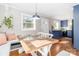 Inviting dining room with a rustic wood table, cozy bench seating, and bright, natural light at 10743 Ola Dr, Fort Mill, SC 29707