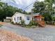Charming home exterior showcasing the front with a deck, shutters, and landscaped garden at 10743 Ola Dr, Fort Mill, SC 29707
