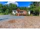 Charming home exterior featuring a deck with pergola, gravel and wood chip ground covering at 10743 Ola Dr, Fort Mill, SC 29707