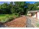 Charming home with a wooden path leading to a well-maintained yard and a unique treehouse feature at 10743 Ola Dr, Fort Mill, SC 29707
