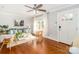 Bright living room with hardwood floors, comfortable seating, and natural light through sheer curtains at 10743 Ola Dr, Fort Mill, SC 29707