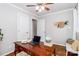 Home office featuring hardwood floors, desk, laptop, neutral paint, doors and windows at 10743 Ola Dr, Fort Mill, SC 29707