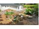 This backyard features a well-kept garden with various herbs and vegetables in raised beds at 10743 Ola Dr, Indian Land, SC 29707