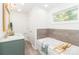 This bathroom features double sinks, a tub, and natural light for added comfort at 10743 Ola Dr, Indian Land, SC 29707
