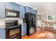 Open kitchen layout with stainless steel appliances, granite countertops, and eat-in area at 10743 Ola Dr, Indian Land, SC 29707