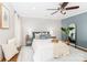 This main bedroom features a ceiling fan, decor, and an ensuite bathroom for added comfort at 10743 Ola Dr, Indian Land, SC 29707