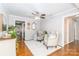 Inviting sitting room featuring hardwood floors, comfortable chairs, and elegant decor at 10743 Ola Dr, Indian Land, SC 29707