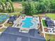 Overhead view of resort-style pool with sun loungers and clubhouse, set within a beautifully landscaped community at 1133 Idyllic Ln, Waxhaw, NC 28173