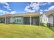 Screened patio with a view of the large backyard, perfect for outdoor entertaining and relaxation at 1133 Idyllic Ln, Waxhaw, NC 28173