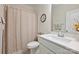 Bathroom featuring a white vanity with towels, a floral picture frame, and a patterned shower curtain at 1133 Idyllic Ln, Waxhaw, NC 28173