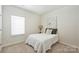Neutral bedroom with a comfortable bed, soft carpet, and a calming atmosphere to relax at 1133 Idyllic Ln, Waxhaw, NC 28173