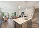 Open concept living room featuring a kitchen island, dining area and a comfortable seating arrangement at 1133 Idyllic Ln, Waxhaw, NC 28173