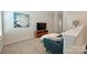 Comfortable loft featuring plush seating, soft carpet and decorated with a white flower painting at 1133 Idyllic Ln, Waxhaw, NC 28173