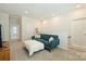 Cozy loft space with a comfortable couch, ottoman, neutral walls and a calming atmosphere at 1133 Idyllic Ln, Waxhaw, NC 28173