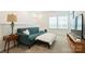 Well-lit loft featuring a plush sofa, an ottoman and a table lamp providing a cozy atmosphere at 1133 Idyllic Ln, Waxhaw, NC 28173