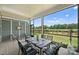 Relaxing screened-in patio with outdoor seating overlooking a green landscape at 1133 Idyllic Ln, Waxhaw, NC 28173