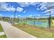 Community tennis courts with blue and green surfaces, surrounded by well-maintained landscaping and a black chain-link fence at 1133 Idyllic Ln, Waxhaw, NC 28173