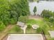 Aerial view showcasing the community amenities, including a gazebo and fire pit near the lake at 117 Lanyard Dr # E, Mooresville, NC 28117