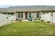 This backyard includes a fenced yard providing privacy and a grassy area for outdoor enjoyment at 117 Lanyard Dr # E, Mooresville, NC 28117