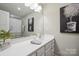 Bright bathroom with white countertop, stylish mirror, modern fixtures, and decorative accents at 117 Lanyard Dr # E, Mooresville, NC 28117