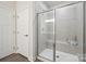 Stylish bathroom features glass enclosed shower, tiled walls, and modern fixtures at 117 Lanyard Dr # E, Mooresville, NC 28117
