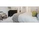 Comfortable bedroom boasts neutral décor, plush bedding, and ample closet space at 117 Lanyard Dr # E, Mooresville, NC 28117