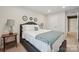 Cozy bedroom featuring a comfortable bed with stylish linens and bedside tables at 117 Lanyard Dr # E, Mooresville, NC 28117
