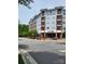 Exterior showcases multi-story building featuring commercial suites and residential balconies in a neighborhood at 117 Lanyard Dr # E, Mooresville, NC 28117