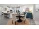 Bright dining area with a round table and chairs, complemented by a stylish cabinet at 117 Lanyard Dr # E, Mooresville, NC 28117