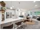 Modern kitchen featuring a quartz countertop island with barstool seating and stainless steel appliances at 117 Lanyard Dr # E, Mooresville, NC 28117
