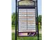 Community sign listing various local businesses including dining, spa, and real estate services at 117 Lanyard Dr # E, Mooresville, NC 28117