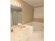 Well-lit bathroom featuring a large tub, white vanity, and tiled shower with glass doors at 1253 Iverleigh Trl, Charlotte, NC 28270
