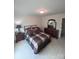 Bedroom features a comfortable bed, wooden furniture, and neutral tones throughout at 1253 Iverleigh Trl, Charlotte, NC 28270