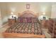 A well-decorated bedroom features matching marble-topped nightstands and a large, upholstered bed at 1253 Iverleigh Trl, Charlotte, NC 28270
