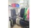A well-organized walk-in closet offers ample storage with tiered racks and overhead shelves at 1253 Iverleigh Trl, Charlotte, NC 28270