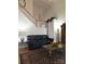 Living room with a black sofa and a decorative table and rug at 1253 Iverleigh Trl, Charlotte, NC 28270