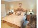 Comfortable primary bedroom with an upholstered headboard and coordinated bedside tables at 1253 Iverleigh Trl, Charlotte, NC 28270