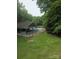 Community pool with lush green surroundings providing a relaxing and refreshing outdoor space at 1253 Iverleigh Trl, Charlotte, NC 28270