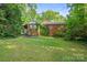 Backyard features a brick exterior and a spacious grassy area at 1315 Cortland E Rd, Charlotte, NC 28209