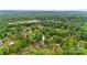 Aerial view of a residential neighborhood with tree-lined streets, houses, and a nearby school, showcasing the community at 1405 8Th Nw Ave, Conover, NC 28613