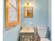 Bathroom with vanity, sink, and toilet, complemented by mosaic tile accents and unique stained glass window at 1405 8Th Nw Ave, Conover, NC 28613