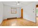 Bedroom with hardwood floors, neutral walls, and a window providing natural light and a ceiling fan at 1405 8Th Nw Ave, Conover, NC 28613