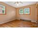 Bedroom featuring hardwood floors, soft tan walls, and large windows offering natural light at 1405 8Th Nw Ave, Conover, NC 28613