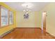 Bright dining room boasts hardwood floors and a classic chandelier at 1405 8Th Nw Ave, Conover, NC 28613